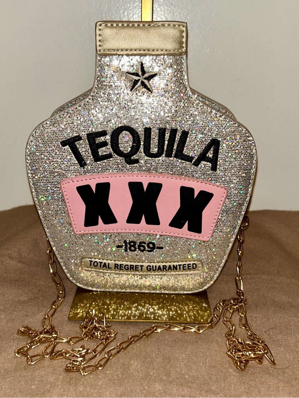 Fozehlad brand novelty purse is shaped like a tequila bottle and BLING